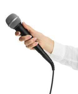female hand with microphone